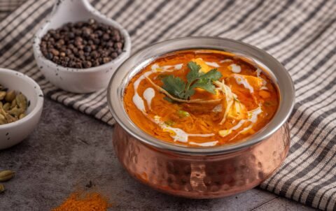 Butter chicken (murgh makhani) in creamy tomato gravy at Tandoori Smoke, best Indian food in Bangkok